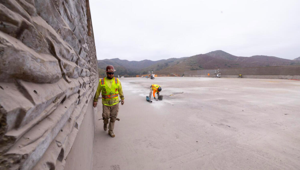 Workers prepare the deck for waterproofing on the Wallis Annenberg Wildlife Crossing on Wednesday, Oct. 16, 2024 in Agoura Hills, CA.