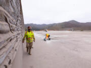 Workers prepare the deck for waterproofing on the Wallis Annenberg Wildlife Crossing on Wednesday, Oct. 16, 2024 in Agoura Hills, CA.