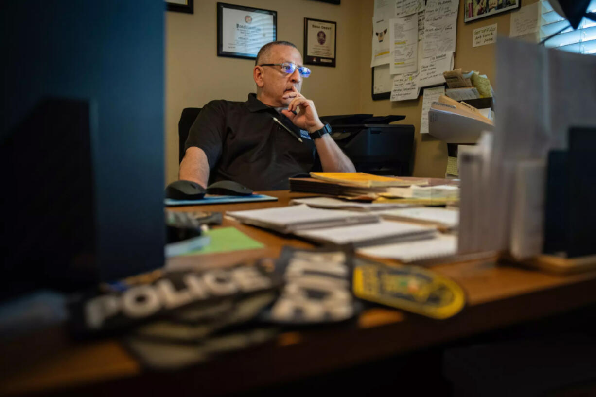 Dana Orent sits in his home office.