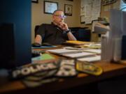 Dana Orent sits in his home office.