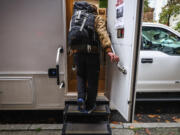 Dan, 44, climbs the steps into an Evergreen Treatment Services&Ccedil;&fnof;&Ugrave; mobile vehicle to get a dose of methadone, Monday, Oct. 28, 2024, in downtown Seattle.