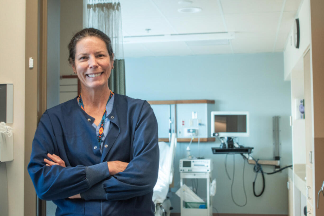 Tracy Ryan, a nurse at Jefferson Healthcare in Port Townsend, stands in front of one of the hospital&rsquo;s maternity ward rooms.