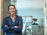 Tracy Ryan, a nurse at Jefferson Healthcare in Port Townsend, stands in front of one of the hospital&rsquo;s maternity ward rooms.