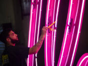 A YESCO employee checks the &ldquo;Debbie&rdquo; neon sign, from the former Debbie Reynolds Hollywood Hotel, on Sept. 17, 2024, at YESCO in Las Vegas.