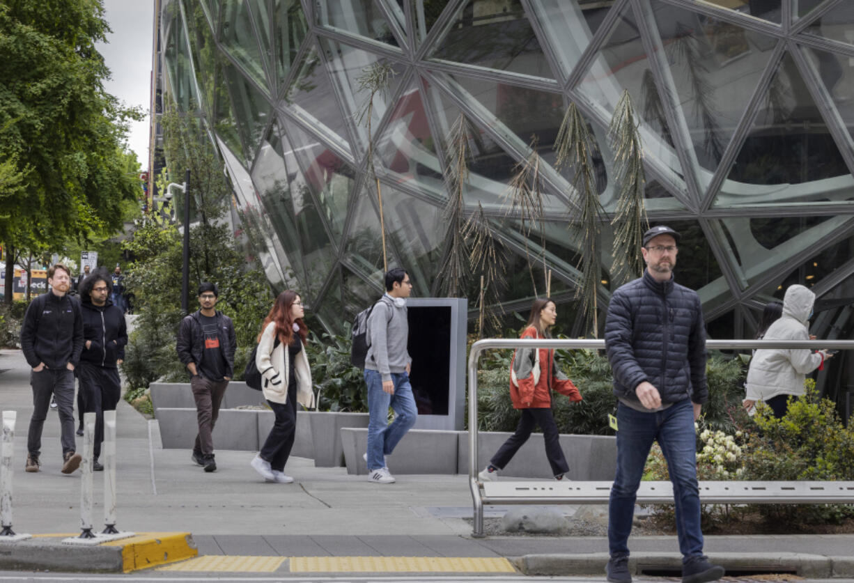 Foot traffic is fairly heavy in front of the Amazon spheres located at Lenora Street and 7th Avenue in Seattle around noontime on May 1, 2023. (Ellen M.