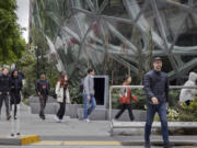 Foot traffic is fairly heavy in front of the Amazon spheres located at Lenora Street and 7th Avenue in Seattle around noontime on May 1, 2023. (Ellen M.