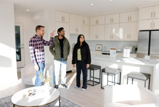 Anurag Kamasamudram, center, and Mayuri Gupta, right, look at a townhome with realtor Matt Miner, left, from Compass, a real estate company, in the Queen Anne neighborhood in Seattle on Sunday, Oct. 27, 2024. The couple has an investment house but this is their first time buying a home for themselves. &Ccedil;&fnof;&uacute;Matt&Ccedil;&fnof;&Ugrave;s helped us understand what we like and don&Ccedil;&fnof;&Ugrave;t like through the tours,&Ccedil;&fnof;&ugrave; says Mayuri. The couple is new to Seattle since May and still learning the neighborhoods. &Ccedil;&fnof;&uacute;He&Ccedil;&fnof;&Ugrave;s helping us understand what areas we want to live in too.&Ccedil;&fnof;&ugrave; she says.