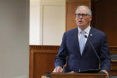 Gov. Jay Inslee speaks to members of the press on Jan. 4, ahead of the 2024 Washington state legislative session.