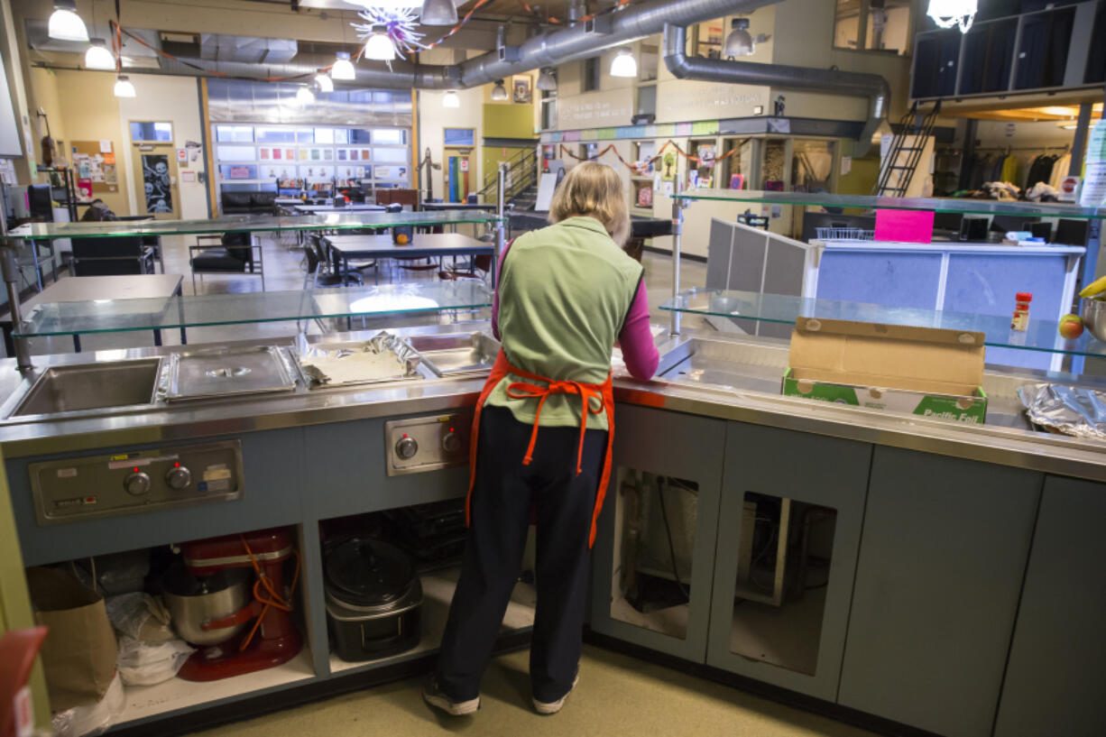 The NE Seattle Moms volunteer group buys, cooks and serves lunch at YouthCare's Orion Center in the South Lake Union neighborhood of Seattle in 2018.