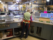 The NE Seattle Moms volunteer group buys, cooks and serves lunch at YouthCare's Orion Center in the South Lake Union neighborhood of Seattle in 2018.