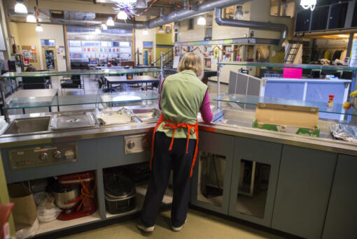 The NE Seattle Moms volunteer group buys, cooks and serves lunch at YouthCare's Orion Center in the South Lake Union neighborhood of Seattle in 2018.