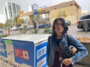 Ember Chow, 24, cast a friend&rsquo;s ballot at a ballot drop box in the U District on Election Day.