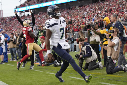 Seattle Seahawks quarterback Geno Smith (7) reacts after scoring against the San Francisco 49ers during the second half of an NFL football game in Santa Clara, Calif., Sunday, Nov. 17, 2024. (AP Photo/Godofredo A.