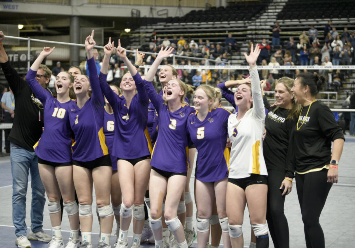 The Columbia River volleyball team looks to its fans after a five-set victory over Ellensburg in the state championship match.