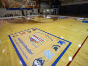 Workers set up banners and signs at Lahaina Civic Center, the venue for the Maui Invitational at Lahaina, Hawai&rsquo;i. The Maui Invitational is back in Lahaina, where eight of the NCAA&rsquo;s top men&rsquo;s basketball teams will compete in a three-day tournament beginning Monday.