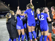 Ridgefield's Abigail Vance (23) and Nora Martin (1) jump in jubilation after defeating Columbia River 1-0 in the championship game on Saturday, Nov. 23, 2024, at Mount Tahoma High School.