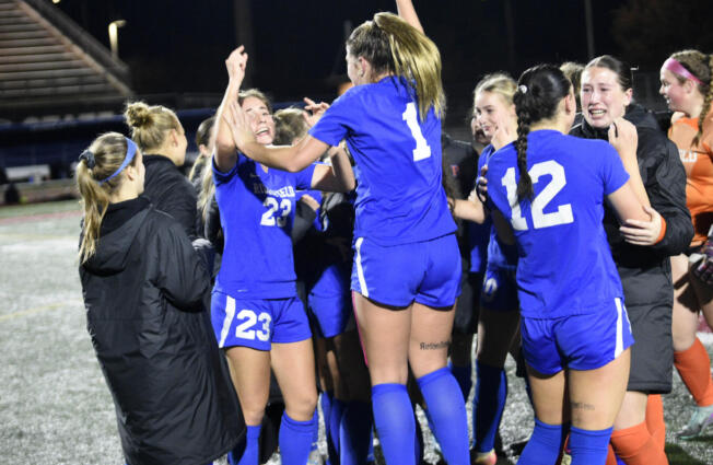 Ridgefield's Abigail Vance (23) and Nora Martin (1) jump in jubilation after defeating Columbia River 1-0 in the championship game on Saturday, Nov. 23, 2024, at Mount Tahoma High School.