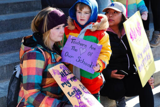 Child care workers, parents and children gather at the Idaho Capitol Building on March 8, 2023, to call attention to state budget cuts to child care provider funding. (Sarah A.