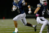 Seton Catholic senior Jacob Williams (4) runs the ball Saturday, Nov. 23, 2024, during the Cougars&iacute; 42-41 win against Life Christian Academy in the 1A State Football Playoff quarterfinals at Doc Harris Stadium in Camas.