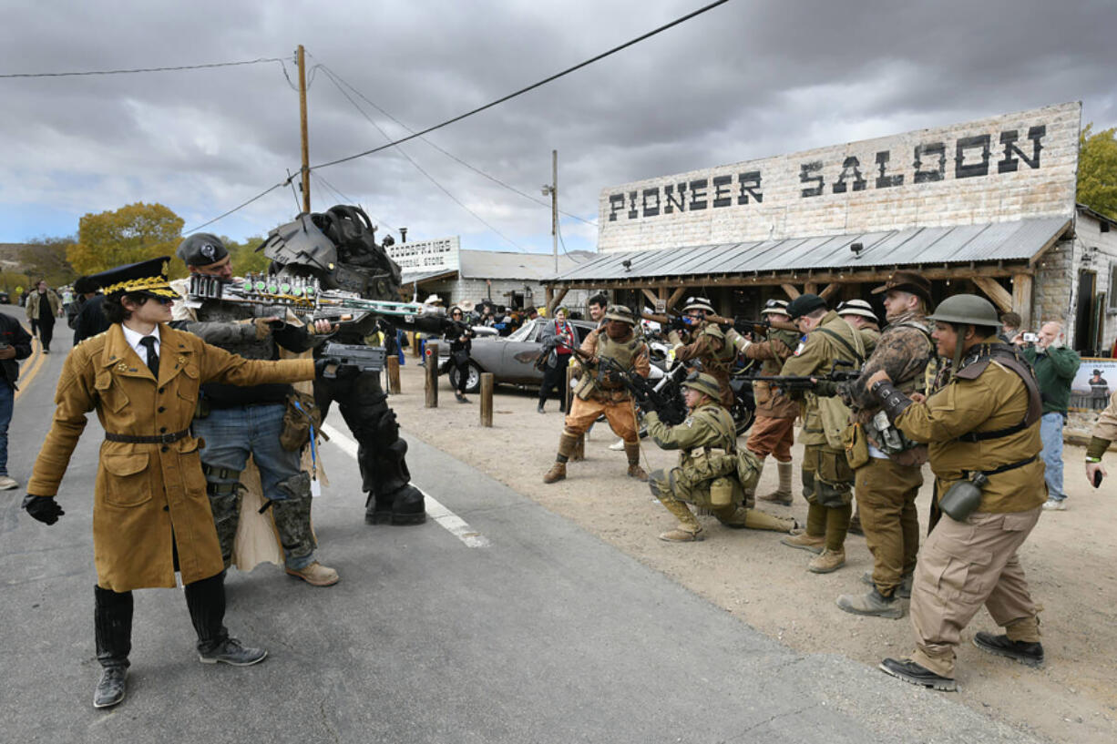 Different factions pretend to face off during the Fallout Fan Celebration on Nov. 16 in Goodsprings, Nev.