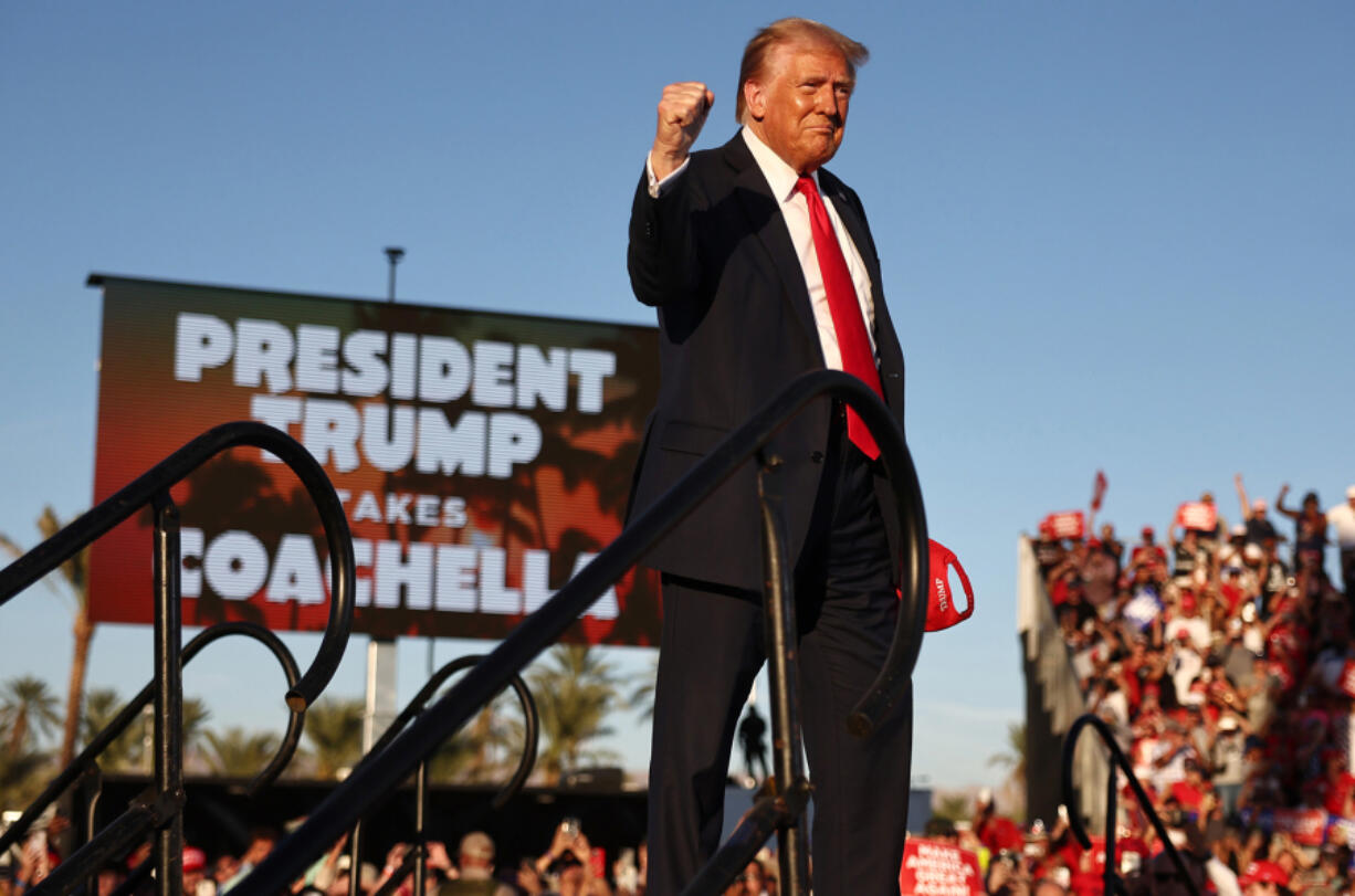 Republican presidential nominee, former U.S. President Donald Trump gestures while walking onstage for a campaign rally on Oct. 12, 2024, in Coachella, California.