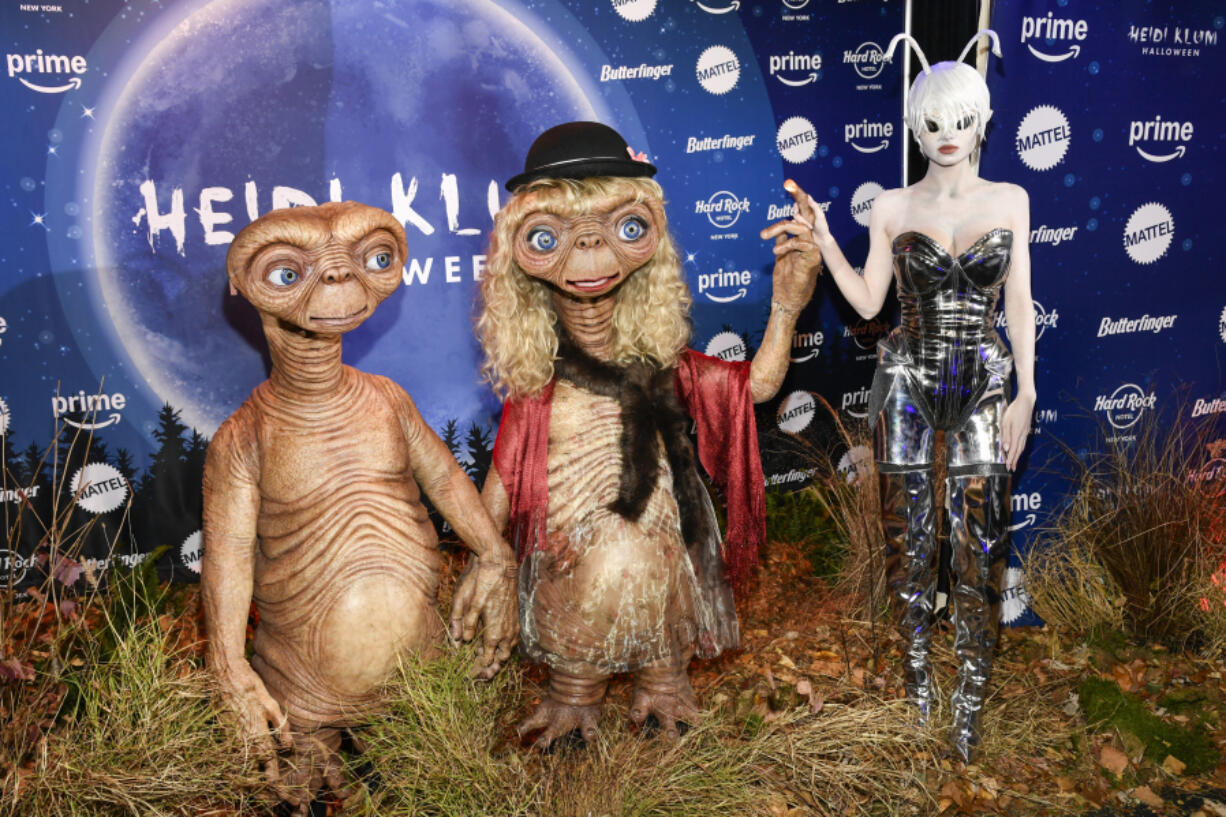 Tom Kaulitz, from left, Heidi Klum, and Leni Olumi Klum attend Heidi Klum&rsquo;s 23rd annual Halloween party on Thursday, Oct. 31, 2024, at Hard Rock Hotel New York in New York.