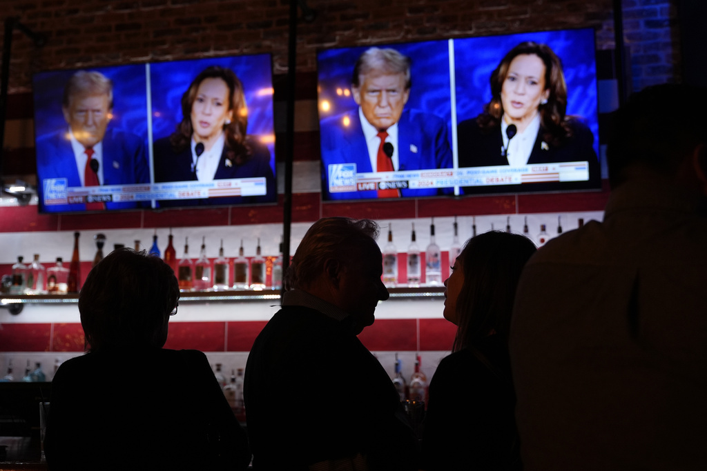 Viewers gather to watch a debate between Democratic presidential nominee Vice President Kamala Harris and Republican presidential nominee former President Donald Trump at the Angry Elephant Bar and Grill, Tuesday, Sept. 10, 2024, in San Antonio.