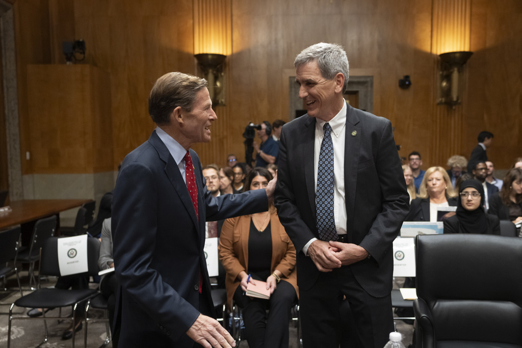 Federal Aviation Administration (FAA) Administrator Mike Whitaker, right, is greeted by Sen. Richard Blumenthal, D-Conn., left, before testifying at a Senate Committee on Homeland Security and Governmental Affairs, Subcommittee on Investigations, hearing on the FAA's oversight of Boeing, on Capitol Hill in Washington, Wednesday, Sept. 25, 2024.