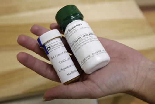 FILE - Bottles of abortion pills mifepristone, left, and misoprostol, right, are displayed at a clinic in Des Moines, Iowa, Sept. 22, 2010.