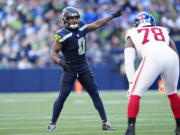 Seattle Seahawks linebacker Tyrel Dodson (0) points during an NFL football game against the New York Giants, Sunday, Oct. 6, 2024 in Seattle. The Giants won 29-20.