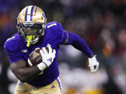 Washington running back Jonah Coleman runs the ball on his way to a touchdown against Southern California during the first half of an NCAA college football game Saturday, Nov. 2, 2024, in Seattle.