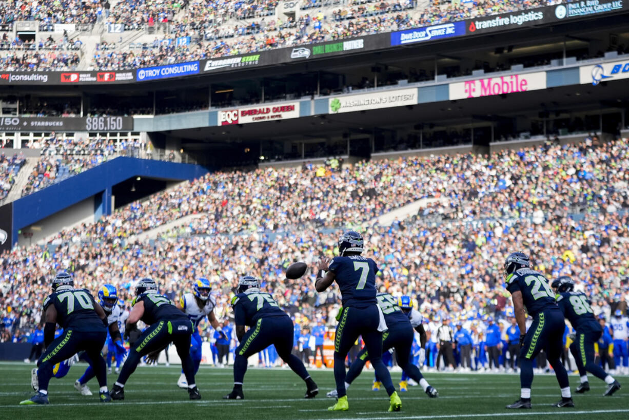 Seattle Seahawks quarterback Geno Smith (7) receives a snap against the Los Angeles Rams during an NFL football game, Sunday, Nov. 3, 2024, in Seattle.