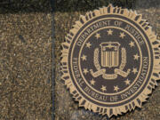 FILE - The seal on the J. Edgar Hoover FBI Building is seen June 9, 2023, in Washington.