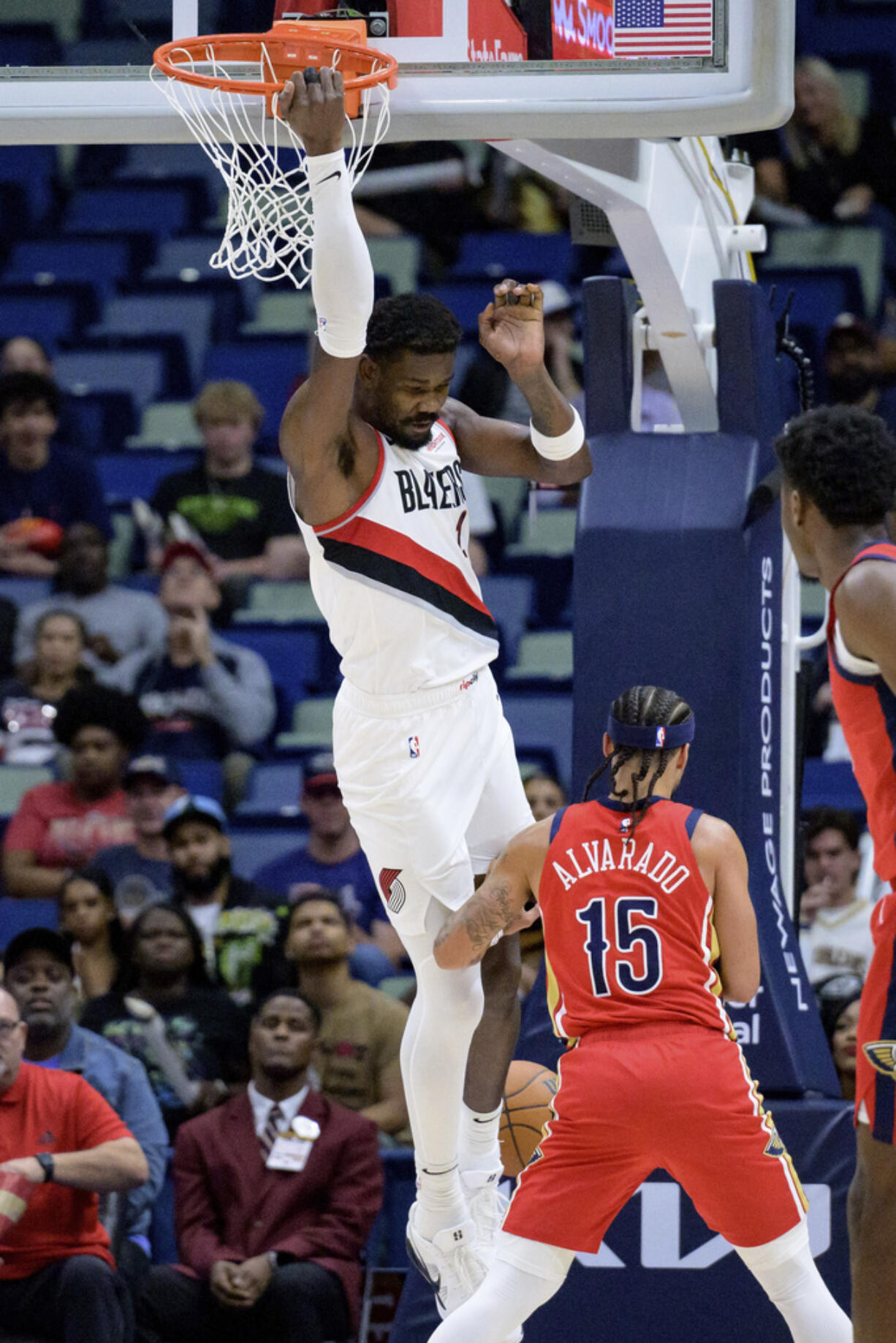 Portland Trail Blazers center Deandre Ayton (2) dunks against New Orleans Pelicans guard Jose Alvarado (15) during the first half of an NBA basketball game in New Orleans, Monday, Nov. 4, 2024.