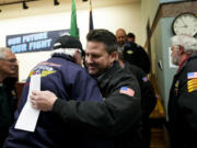 IAM District 751 president Jon Holden greets union members after announcing they voted to accept a new contract offer from Boeing, Monday, Nov. 4, 2024, at their union hall in Seattle.