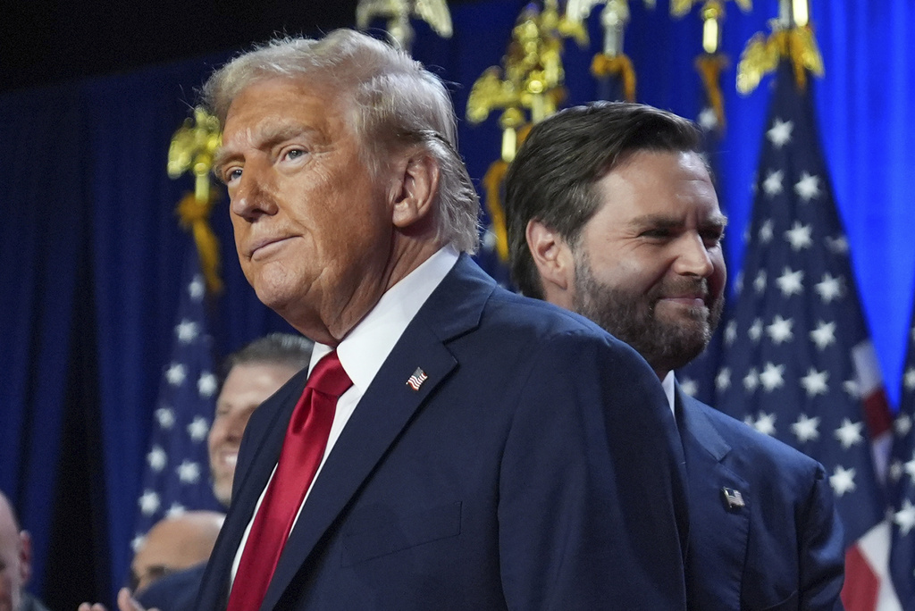 Republican presidential nominee former President Donald Trump and his running mate Sen. JD Vance, R-Ohio, stand on stage at an election night watch party at the Palm Beach Convention Center, Wednesday, Nov. 6, 2024, in West Palm Beach, Fla.