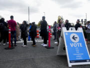 People line up outside King County Elections headquarters on Election Day, Tuesday, Nov. 5, 2024, in Renton, Wash.