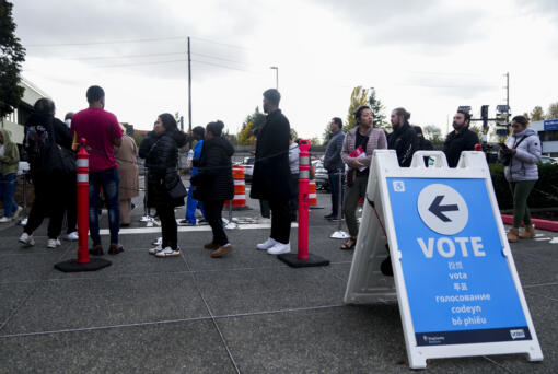 People line up outside King County Elections headquarters on Election Day, Tuesday, Nov. 5, 2024, in Renton, Wash.