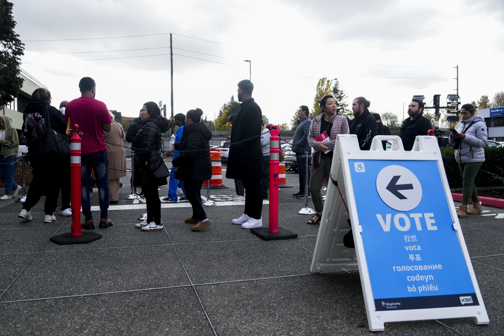 People line up outside King County Elections headquarters on Election Day, Tuesday, Nov. 5, 2024, in Renton, Wash.