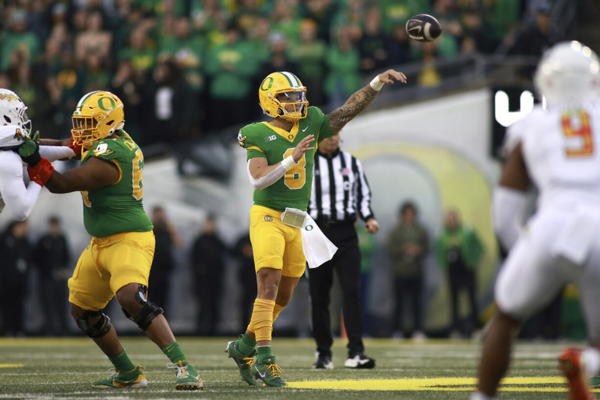 Oregon quarterback Dillon Gabriel (8) passes the ball during an NCAA college football game against Maryland, Saturday, Nov. 9, 2024, in Eugene, Ore.