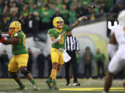 Oregon quarterback Dillon Gabriel (8) passes the ball during an NCAA college football game against Maryland, Saturday, Nov. 9, 2024, in Eugene, Ore.