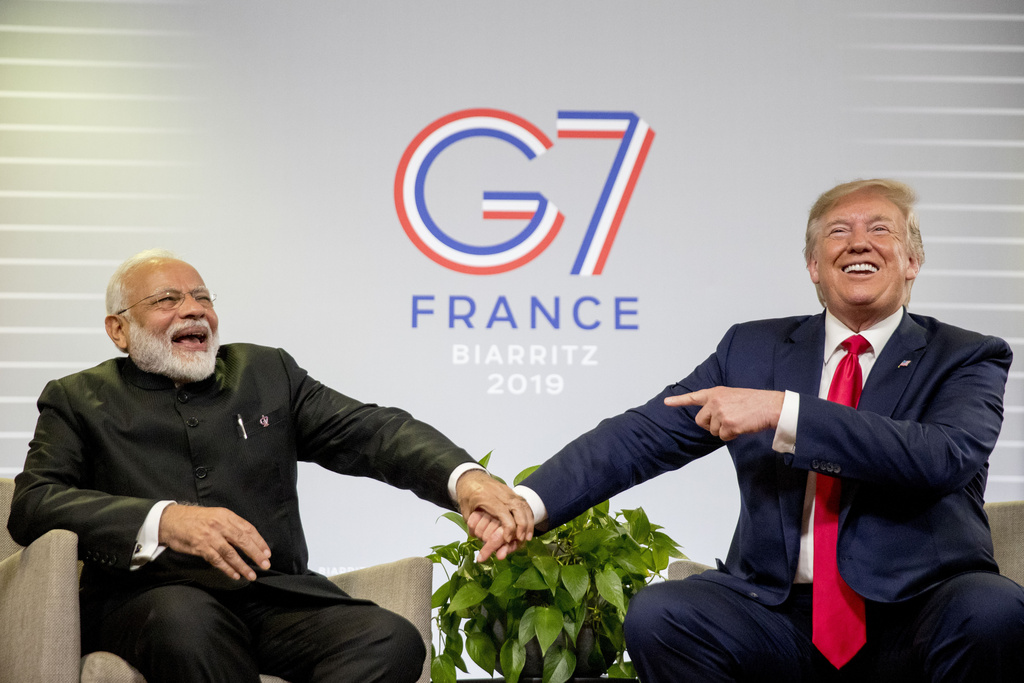 FILE- President Donald Trump and Indian Prime Minister Narendra Modi, left, share a laugh together during a bilateral meeting at the G-7 summit in Biarritz, France, Aug. 26, 2019.