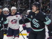 Seattle Kraken left wing Tye Kartye celebrates his goal against the Columbus Blue Jackets during the second period of an NHL hockey game Tuesday, Nov. 12, 2024, in Seattle.