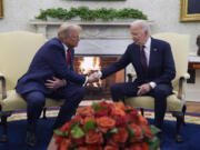 President Joe Biden meets with President-elect Donald Trump in the Oval Office of the White House, Wednesday, Nov. 13, 2024, in Washington.