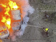 In this photo provided by the Ukrainian Emergency Service, emergency services personnel work to extinguish a fire following a Russian rocket attack in Poltava region Ukraine, Sunday, Nov. 17, 2024.