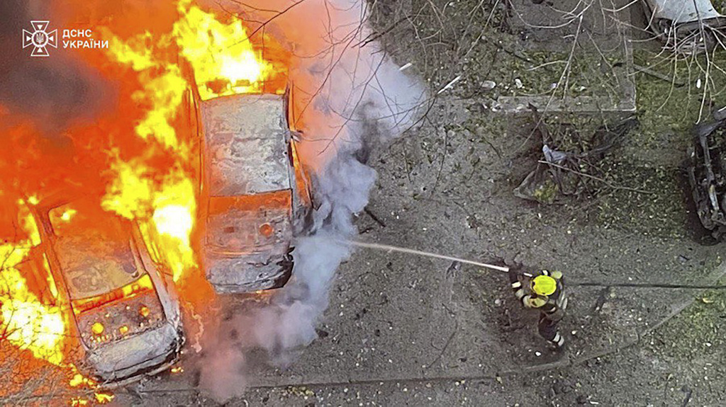 In this photo provided by the Ukrainian Emergency Service, emergency services personnel work to extinguish a fire following a Russian rocket attack in Poltava region Ukraine, Sunday, Nov. 17, 2024.