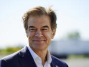 FILE - Mehmet Oz visits the AW Driving School &amp; License Testing Center in Allentown, Pa., Sept. 23, 2022.