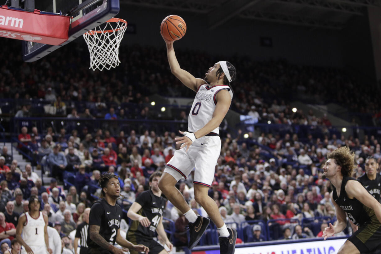 Gonzaga guard Ryan Nembhard (0) shoots during the second half of an NCAA college basketball game against Long Beach State, Wednesday, Nov. 20, 2024, in Spokane, Wash.