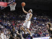 Gonzaga guard Ryan Nembhard (0) shoots during the second half of an NCAA college basketball game against Long Beach State, Wednesday, Nov. 20, 2024, in Spokane, Wash.