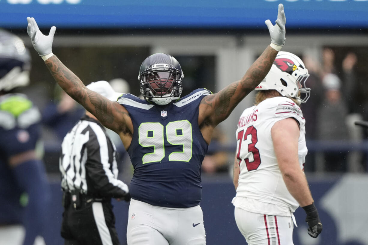 Seattle Seahawks defensive end Leonard Williams (99) celebrates a sack during an NFL football game against the Arizona Cardinals, Sunday, Nov. 24, 2024, in Seattle.